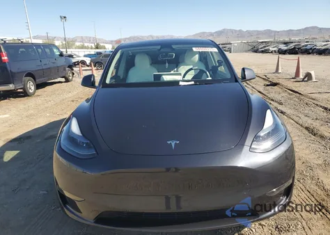 2025 Tesla Model Y from USA, damaged, VIN 7SAYGDED0SF249701